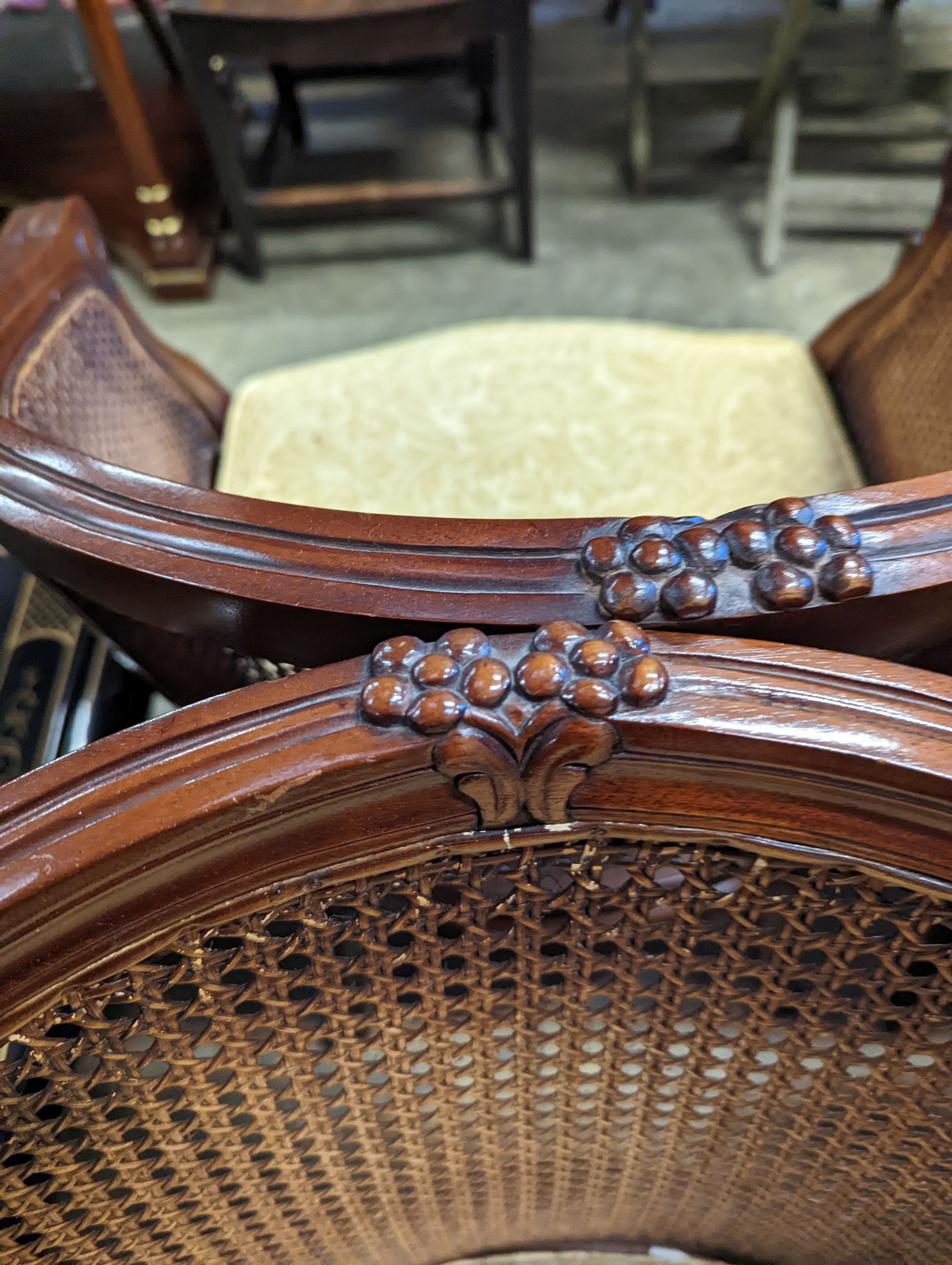 A pair of French mahogany bergere tub chairs, width 62cm, depth 50cm, height 86cm